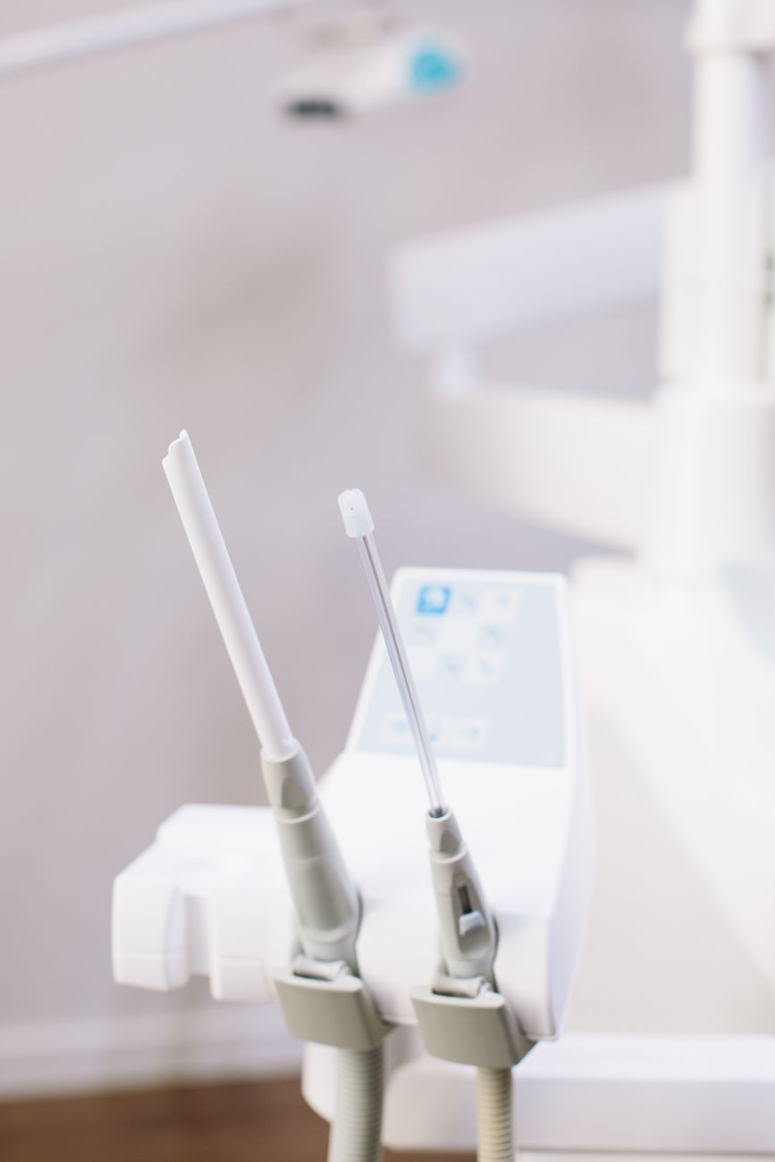 Clear aligners held by a clinician